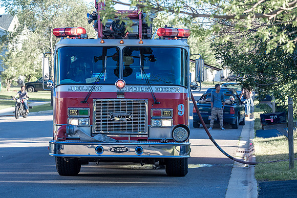 Backyard house fire in Joliet, IL